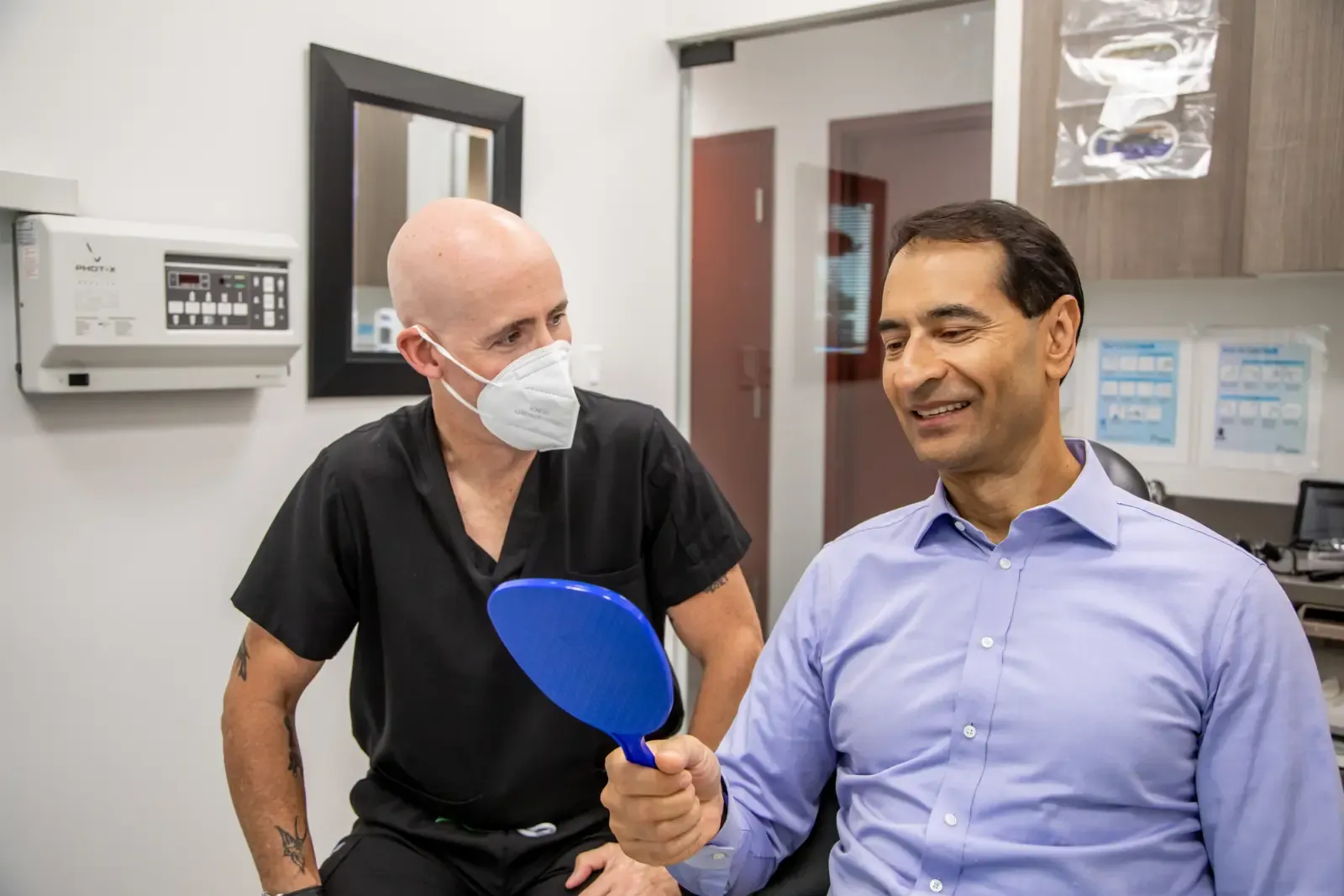 Dr. Noah Belman discussing a personalized treatment plan with a patient