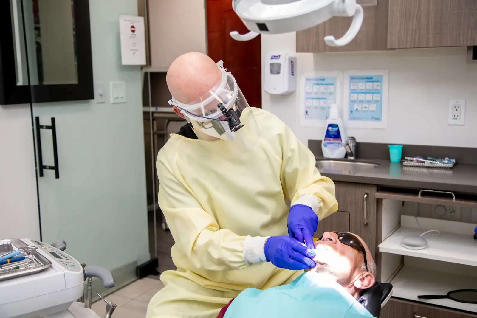 Dr. Noah Belman providing care in a Belman Dental Centre treatment room