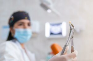 A dentist showing a broken tooth