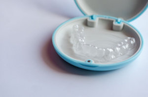An image of clear aligners in their storage case.